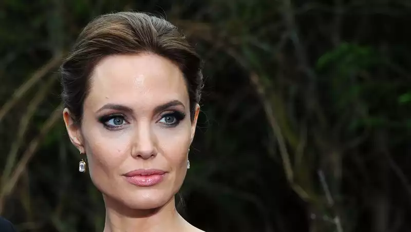 Angelina Jolie deftly dodges questions about The Weeknd, with whom she is rumored to be dating.