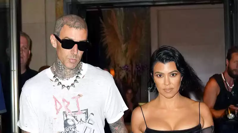 Travis Barker, Kourtney Kardashian's lip and scorpion tattoos hide her ex's name.