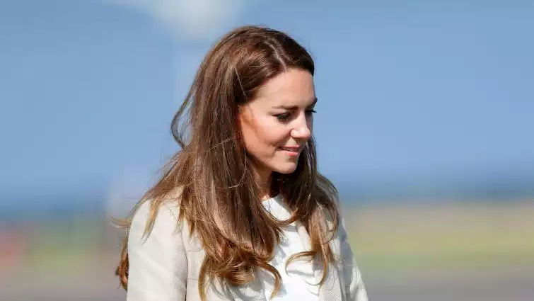 Kate Middleton in a cream dress in her latest engagement.