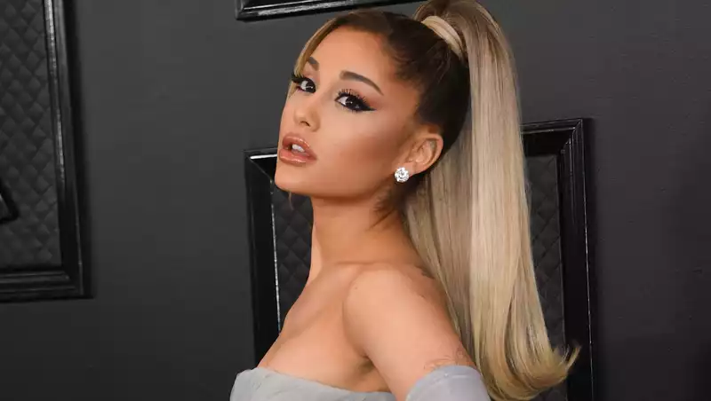 Ariana Grande's brown silk midi dress offers the perfect summer evening outfit