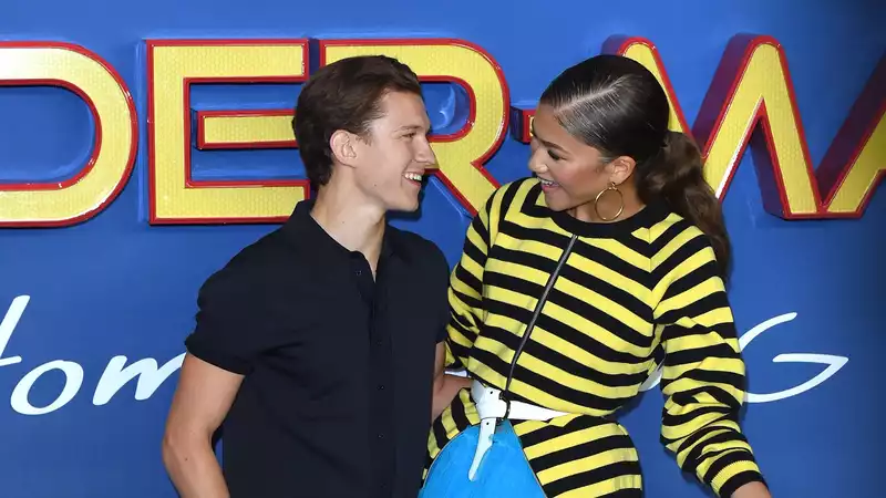 Tom Holland and Zendaya photographed kissing in a car in Los Angeles.