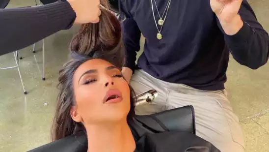 Kim Kardashian dozes off during a photo shoot.