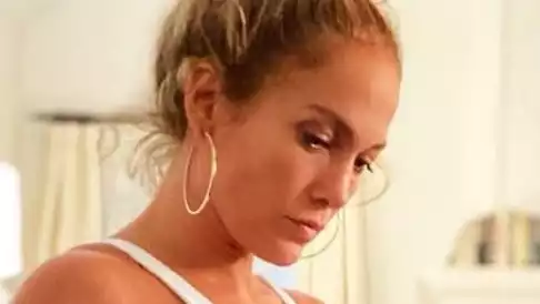 J.Lo, impossibly beautiful in a white one-piece swimsuit