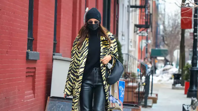 Irina Shayk's tiger print trench proves that winter clothing doesn't have to be boring.