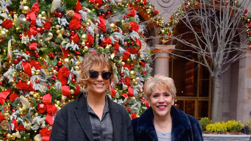 J.Lo celebrates her mother's 75th birthday in a burgundy shirt dress