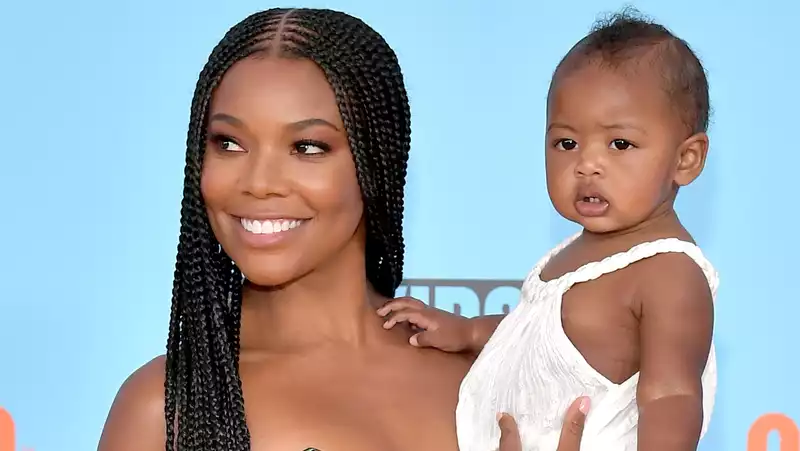 Gabrielle Union and her daughter Kaavia, adorably twinned in a striped dress.