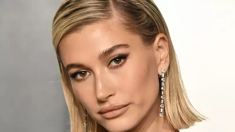 Hailey Bieber wears Yves Saint Laurent high-slit gown for her 24th birthday