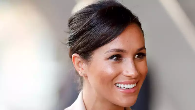 Meghan Markle Offers Workwear Inspiration in Brown Silk Shirt