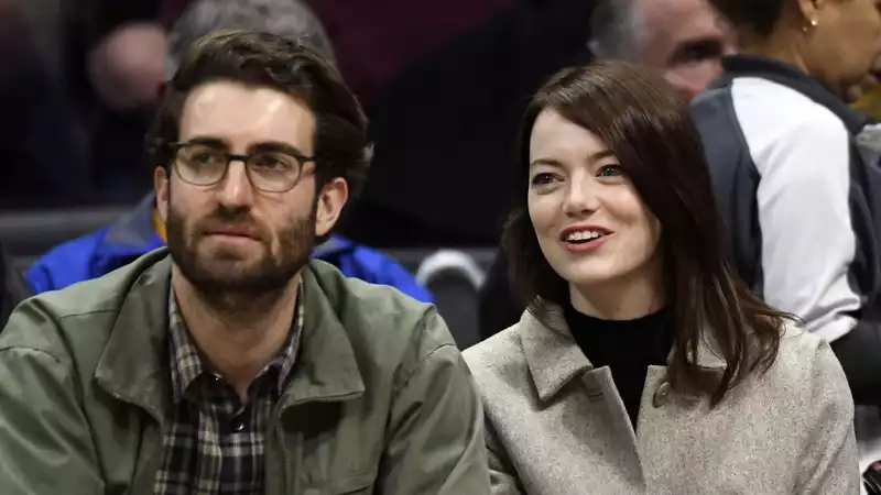 Emma Stone and Dave McCurry, seen wearing matching rings, are rumored to be married again.