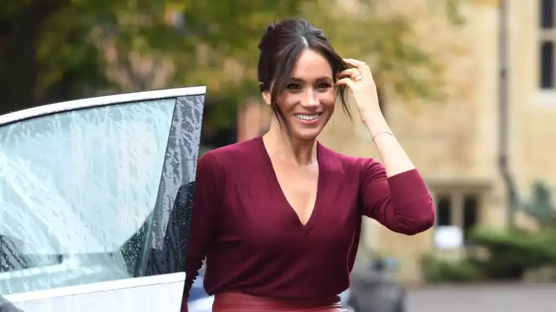 British royal reprimands Meghan Markle for wearing a necklace with Harry's initials.