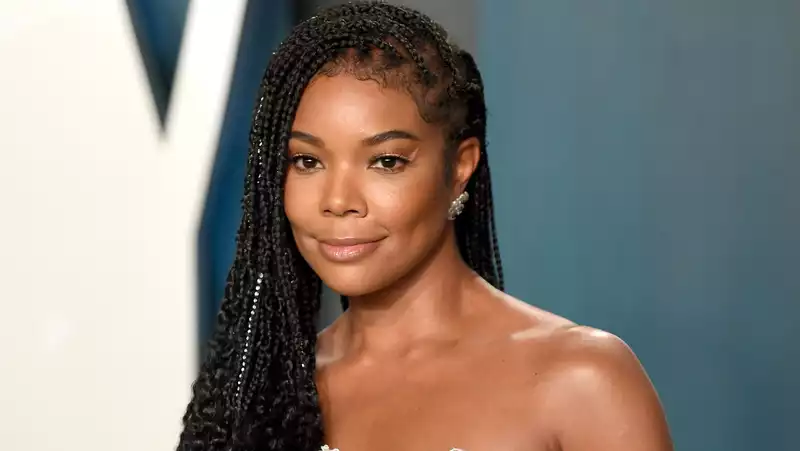 Gabrielle Union with her daughter Carvia in the coolest pastel blue culotte suit