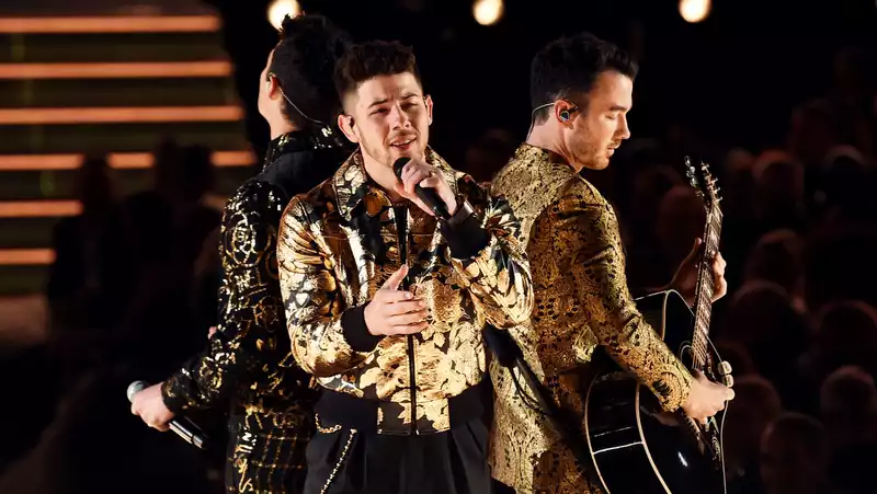 Nick Jonas jokes about getting food in his teeth during the Jonas Brothers' Grammy performance.