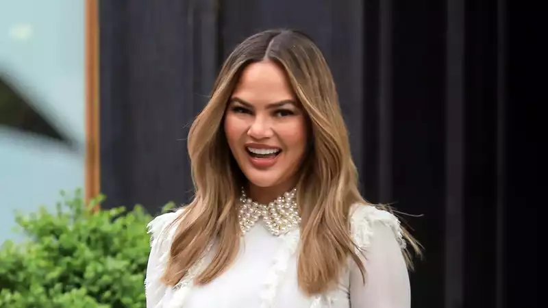 Chrissy Teigen Solves Longtime Fan Mystery with Dolly Parton Challenge