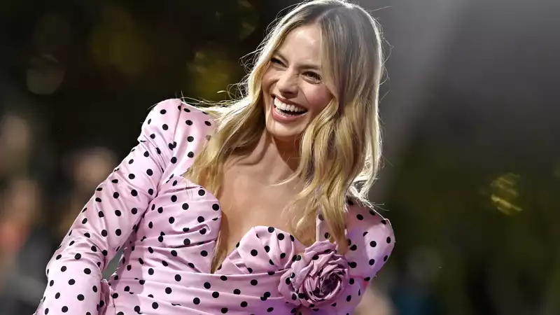 Margot Robbie transforms into Balmain Barbie with pink polka dots and rosettes