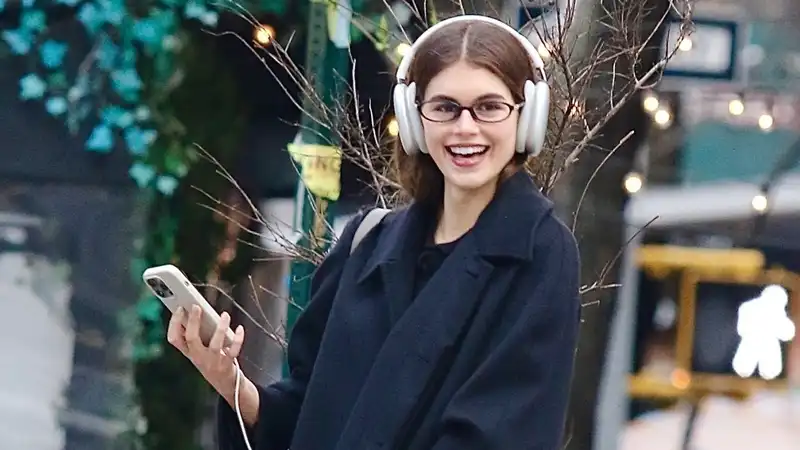 Kaia Gerber, spring coat with soccer shoes.