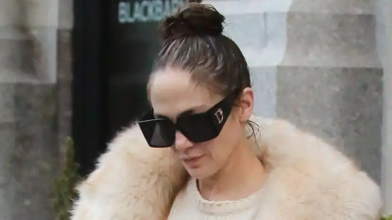 Jennifer Lopez, neutral pajamas with fur coat and Birkin bag