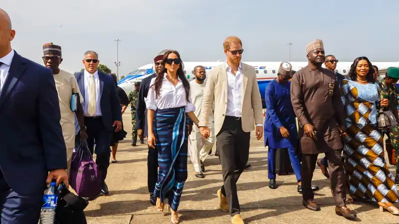 Prince Harry and Meghan Markle have brought a personal photographer to visit Nigeria over the weekend