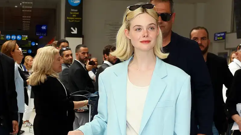 Elle Fanning elevates her Cannes travel outfit through an underrated spring color trend