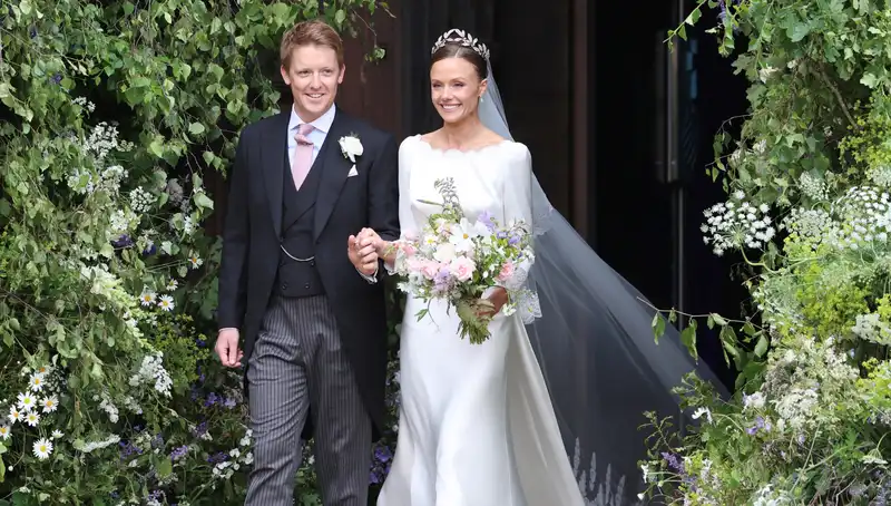 Olivia Henson's romantic wedding dress contains hidden references to family heirlooms