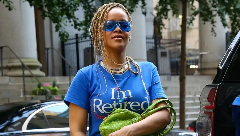 Rihanna's "I'm Retired" T-shirt dress sends fans waiting for new music into a spiral