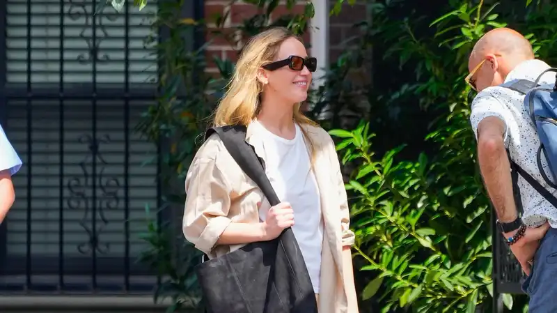 Jennifer Lawrence keeps it cool in trendy parachute pants and $1,050 slides from The Row