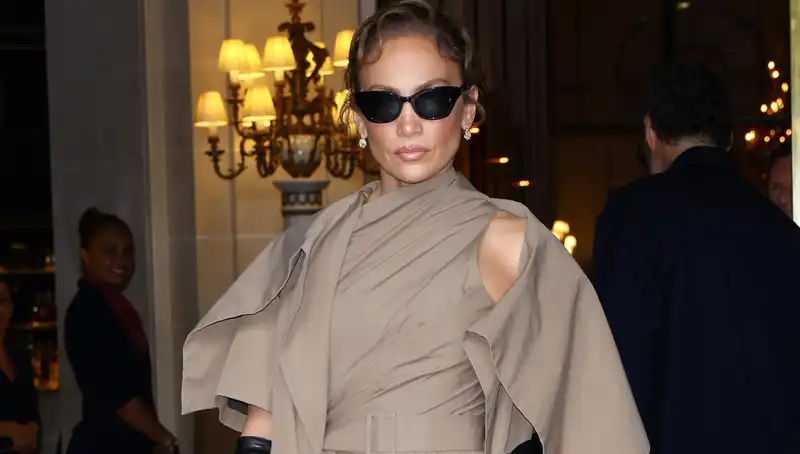 Jennifer Lopez makes an unexpected stop at Dior's Paris Couture show, looking svelte.