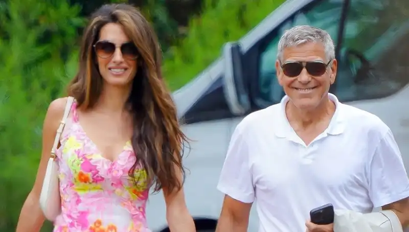 Amal Clooney vacations in a precious vintage Versace dress.