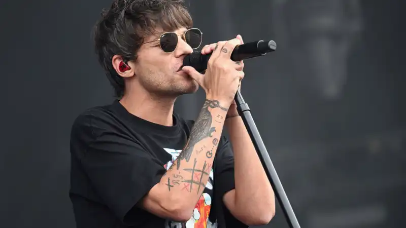 Louis Tomlinson Brings TV to Glastonbury Festival organizers refuse to show England soccer match