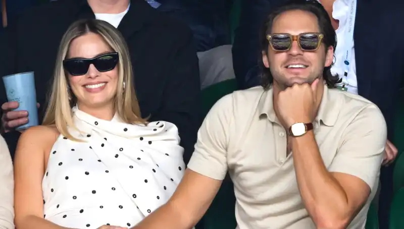 Margot Robbie shows off her maternity style at Wimbledon in a trendy whimsical polka dot dress.