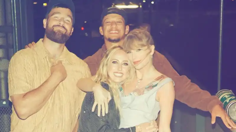 Travis Kells held Taylor Swift in his arms as the three of them enjoyed a private date.