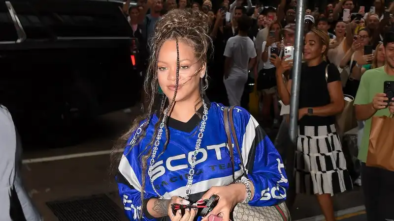 Rihanna revives her high-low uniform with camo cargo pants and Gucci tote