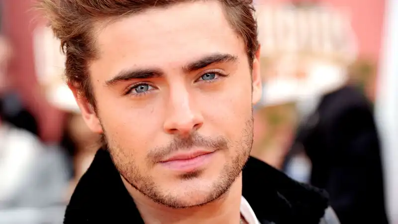 Zac Efron assures fans that he is "happy and healthy" after brief hospitalization.