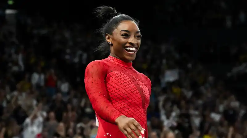 Simone Biles Wins Seventh Gold Medal in "Power Color" Red Leotard with 3,600 Swarovski Crystals