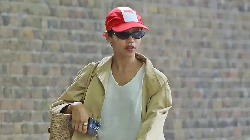 Taylor Russell pairs a classic trench coat with one of the sneaker trends for 2024