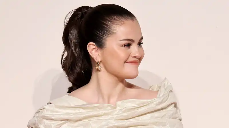 Selena Gomez switches from little white dress to Olympic gold mini