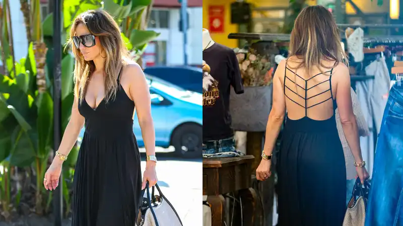 Jennifer Lopez elevates an all-black maxi dress with a bold open back