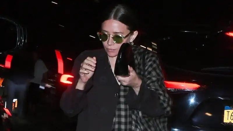 Ashley Olsen's coat and $900 flip-flop outfit is as confusing as it is chic.