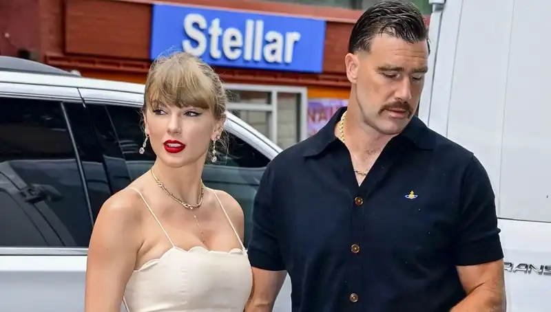 Taylor Swift takes Travis Kells to an Electric Lady Studios wedding in a Zimmerman cutout dress.