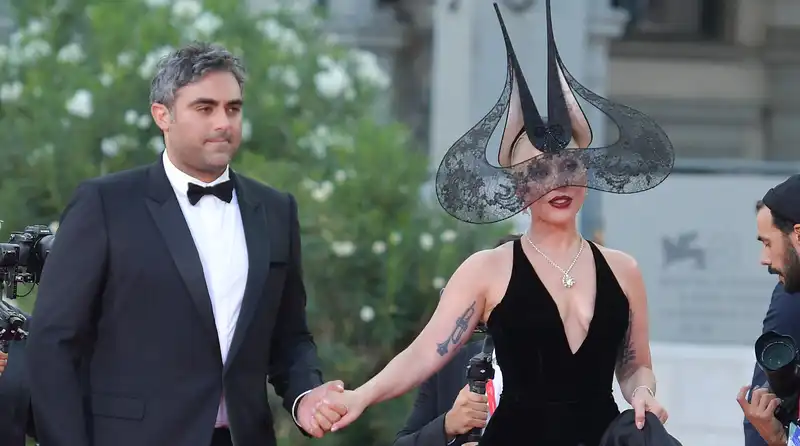 Lady Gaga and fiancé Michael Polanski hit the red carpet at the Venice International Film Festival.