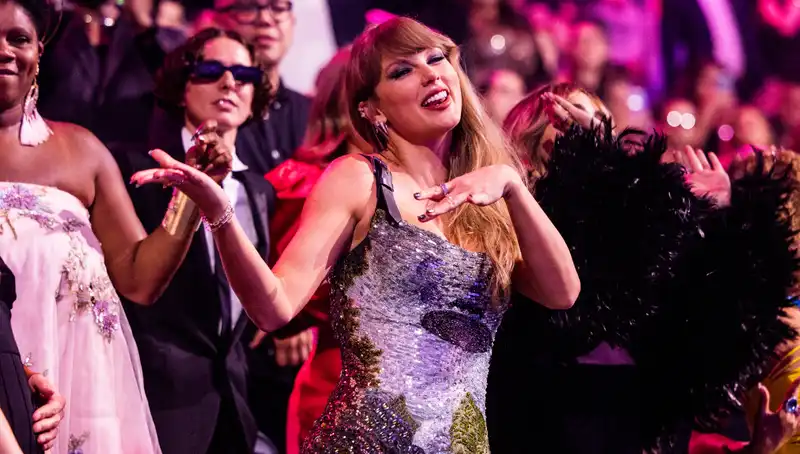 Taylor Swift appears at the VMAs in a UFO-like sequined mini-dress.