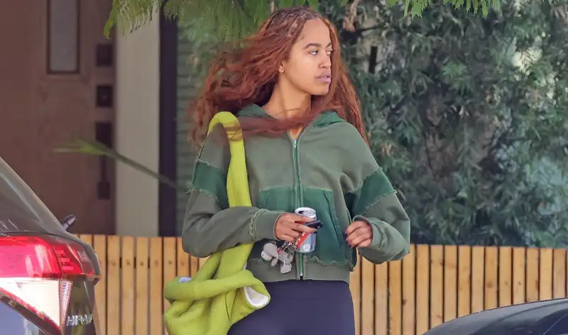 Malia Obama brunches in a brat green taco purse and polarized sporty sandals.