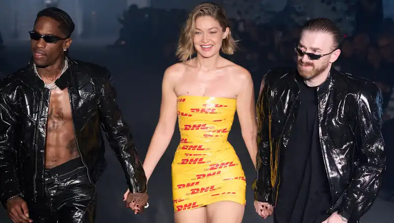 Gigi Hadid on Vetements Paris Fashion Week runway in a DHL tape mini dress