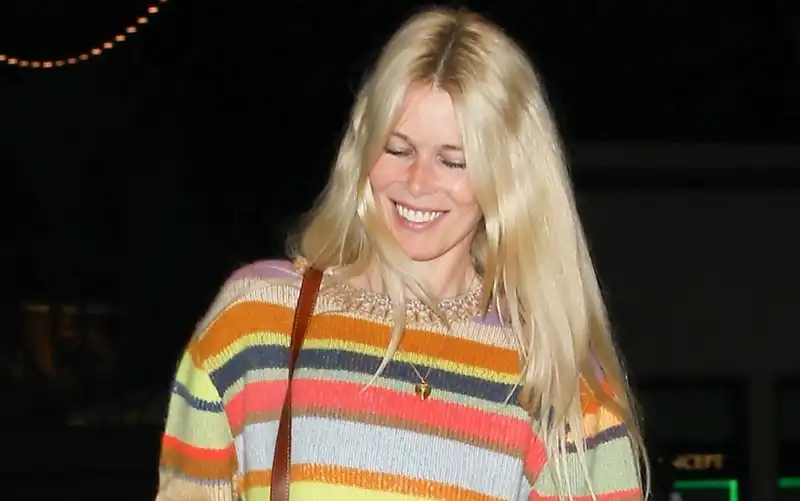 Claudia Schiffer shines in the rainbow-striped cashmere sweater of her dreams.