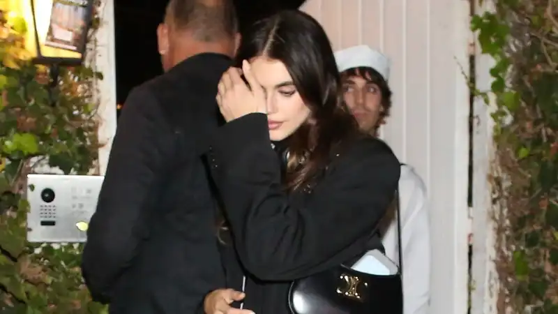 Kaia Gerber hiding a Halloween costume under a chic black blazer?