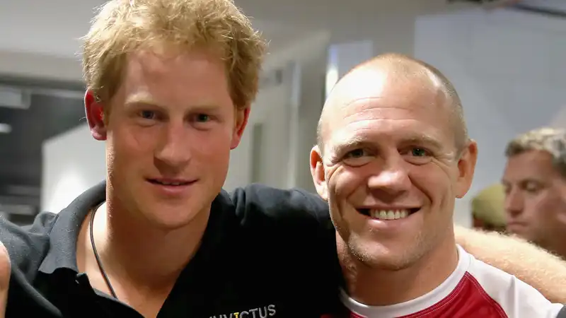 Mike Tindall says he got into trouble when he “pretended” to hit Prince Harry.