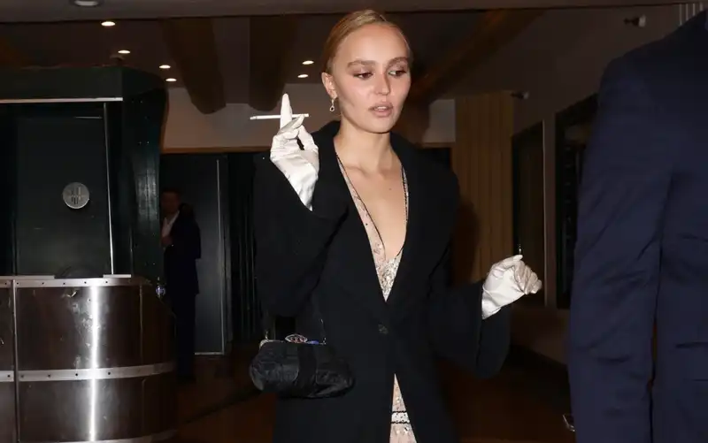 Lily Rose Depp plays the ultimate Girlfriend in vintage Chanel and silk Opera Gloves