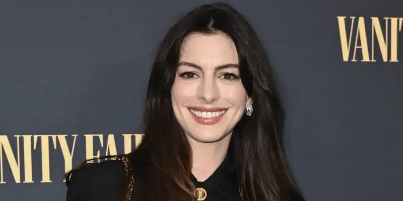 Anne Hathaway enjoys a post-election sanity walk in comfortable all-white basics with Adidas Samba