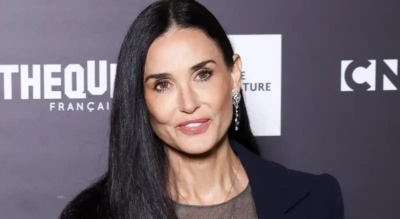 Demi Moore channels Meghan Markle in a navy blazer and 3D floral dress