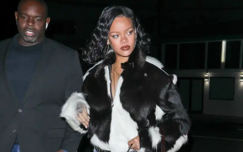 Rihanna is the poster child of the autumn cow print trend, wearing a fur coat and a Fendi baguette that fits it