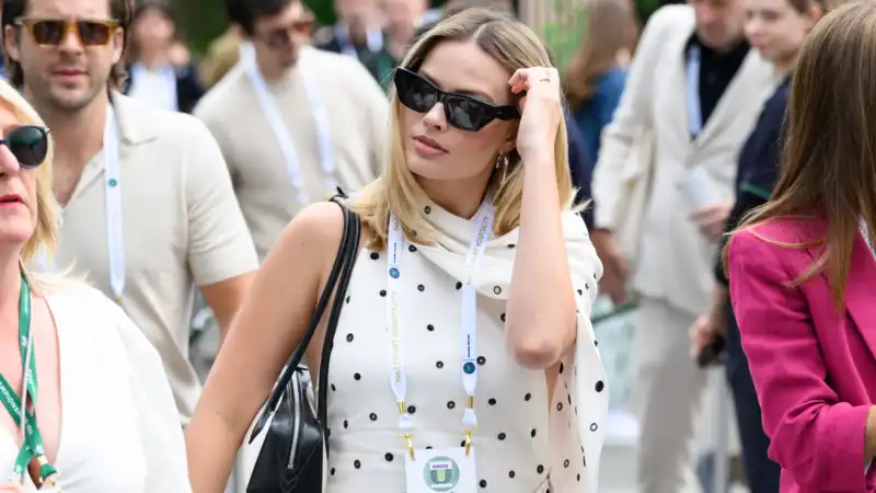 Instead of sneakers, Margot Robbie takes her hot girl walking in a puff sleeve dress and Mary Jane